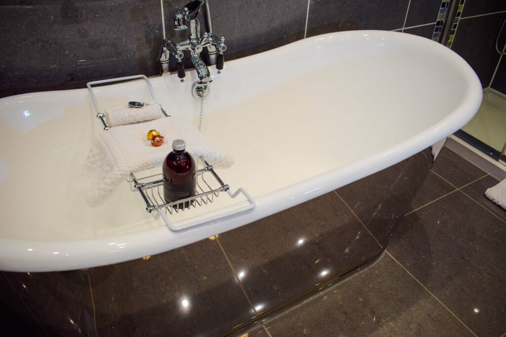Out Outlander Hideaway has a statement chrome free-standing two person bath.