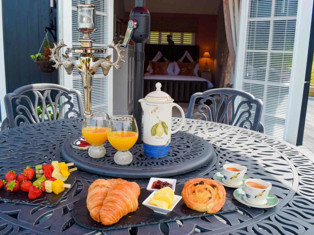 Stock up at the local shops and enjoy al fresco breakfast on the decking outside your bedroom at Little Fox Lodge, Glencoe.